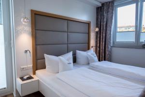 Postel nebo postele na pokoji v ubytování Hotel Freisicht