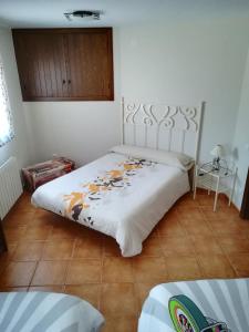 Ένα ή περισσότερα κρεβάτια σε δωμάτιο στο Apartamentos Hermanas Montolio