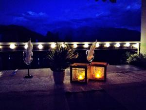 a table with candles and lights on a balcony at Barbi Exclusive Apartment in Bad Mitterndorf