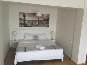
Postel nebo postele na pokoji v ubytování H'otel Korall Residence
