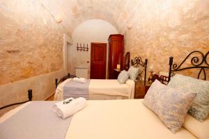 a bedroom with two beds in a room at Quality Villa Es Molí in Porreres
