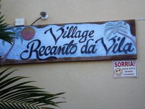 a sign on the side of a building at Apart para até 6 Pessoas - PF in Praia do Forte