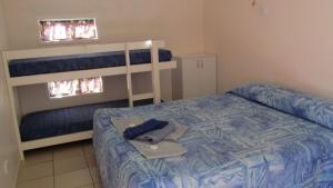 מיטה או מיטות בחדר ב-Homestead Caravan Park