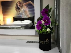 Postel nebo postele na pokoji v ubytování Garni Hotel Hollywoodland Wellness & Aquapark