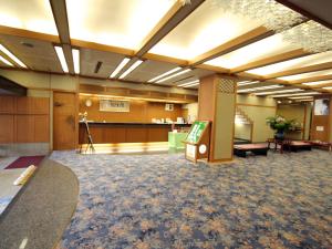 a large room with a waiting area and a lobby at Hoseikan in Matsue