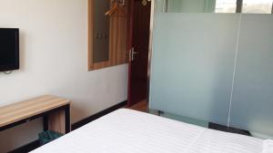 Katil atau katil-katil dalam bilik di Thank Inn Chain Hotel Tianjin Jixian Zhongchang Road