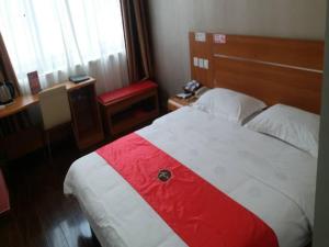 Posteľ alebo postele v izbe v ubytovaní Thank Inn Chain Hotel Shandong Rizhao North Develop Zone Baoshan Road