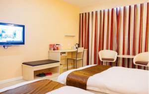 Photo de la galerie de l'établissement Thank Inn Chain Hotel Jiangsu Nantong Haimen Jiefang East Road, à Xinhai