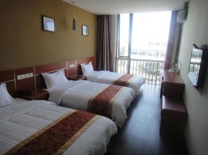 Lova arba lovos apgyvendinimo įstaigoje Thank Inn Chain Hotel Jiangsu Suzhou Shitang Road