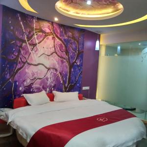 Rúm í herbergi á Thank Inn Plus Hotel Jiangsu Taizhou Xinghua Anfeng Town