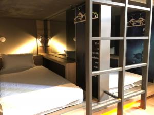 A bed or beds in a room at Taipei Discover Hostel