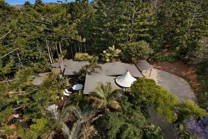 an aerial view of a house in the middle of a forest at Azabu Retreat & Spa in Byron Bay