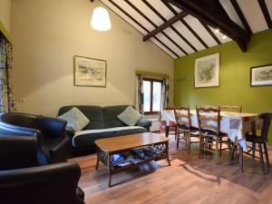 a living room with a couch and a table at detached chalet in lovely hiking region in Bellevaux