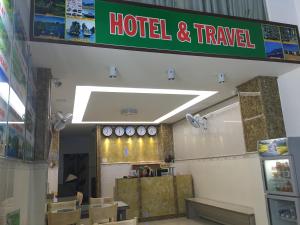 a hotel and travel sign on the wall of a restaurant at Ailen Garden 2 Hotel in Ho Chi Minh City