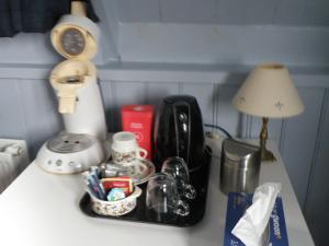 a tray filled with utensils on a kitchen counter at B & B Eindelinge in Serooskerke