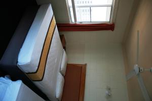 a bedroom with a bunk bed and a window at Luma Luma Holiday Apartments in Darwin