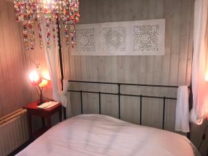 Posteľ alebo postele v izbe v ubytovaní Chalet de Charme