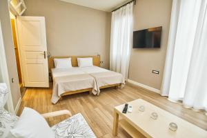 Posteľ alebo postele v izbe v ubytovaní Casa Mia Apartments