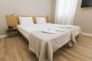 Posteľ alebo postele v izbe v ubytovaní Casa Mia Apartments