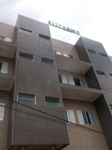 a tallartment building with a building at Marinho Plaza Hotel in Capellinha