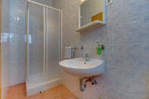 a bathroom with a sink and a shower at Anka in Nerezine +47 photos
