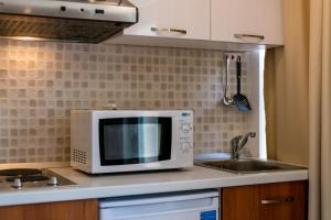 Kuchyňa alebo kuchynka v ubytovaní Studio apartment Oleander
