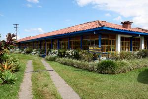 a building with a garden in front of it at Finca Hotel Los Girasoles in Montenegro