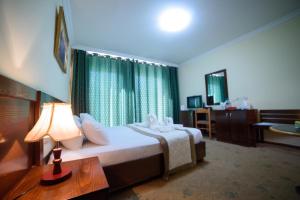 Postel nebo postele na pokoji v ubytování Sancta Maria Hotel + 37 fotografií