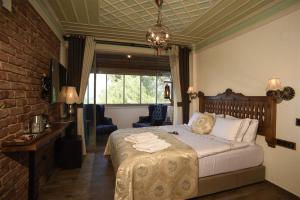 Postel nebo postele na pokoji v ubytování Ayşe Hanım Konağı