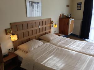 Postel nebo postele na pokoji v ubytování Carels Kamers Texel