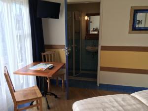 Postel nebo postele na pokoji v ubytování Carels Kamers Texel