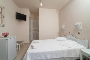 Letto o letti in una camera di Amaryllis Hotel