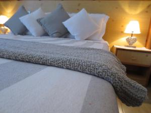 Postel nebo postele na pokoji v ubytování Hotel Aurora