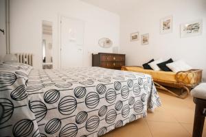 A bed or beds in a room at La Fabbrica di San Pietro B&B