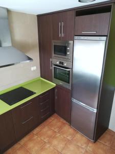 Η κουζίνα ή μικρή κουζίνα στο Apartamentos Hermanas Montolio