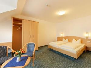 Postel nebo postele na pokoji v ubytování Hotel Jagermo