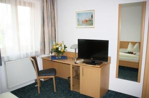 TV a/nebo společenská místnost v ubytování Hotel Jagermo