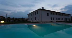 a large swimming pool in front of a building at Villa Solaris Hotel & Residence in Tezze sul Brenta