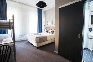 Postel nebo postele na pokoji v ubytování Hotel Hötorget
