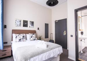 Postel nebo postele na pokoji v ubytování Hotel Hötorget