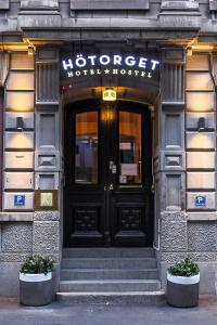 a building with a sign on the front of it at Hotel Hötorget in Stockholm