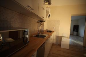 Kuchyňa alebo kuchynka v ubytovaní Apartament Rodzinny S8