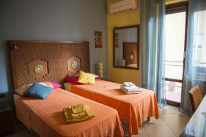 Katil atau katil-katil dalam bilik di Dolce Conca D'Oro B&B