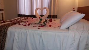 Un pat sau paturi într-o cameră la Picol Hostal