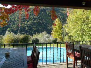 a balcony with a view of a swimming pool at Can Barrina in Montseny