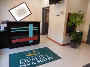 a waiting area with a mat on the floor in a office at Quality Inn near Sunset Park in Brooklyn