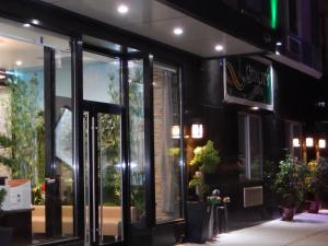 a store front with glass doors at night at Quality Inn near Sunset Park in Brooklyn