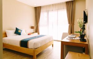Postel nebo postele na pokoji v ubytování Minh Nhung Hotel