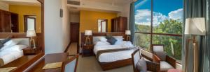 Letto o letti in una camera di Sooriya Resort & Spa