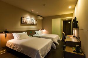 Katil atau katil-katil dalam bilik di Jinjiang Inn Select Shaoxing Jiefang North Road